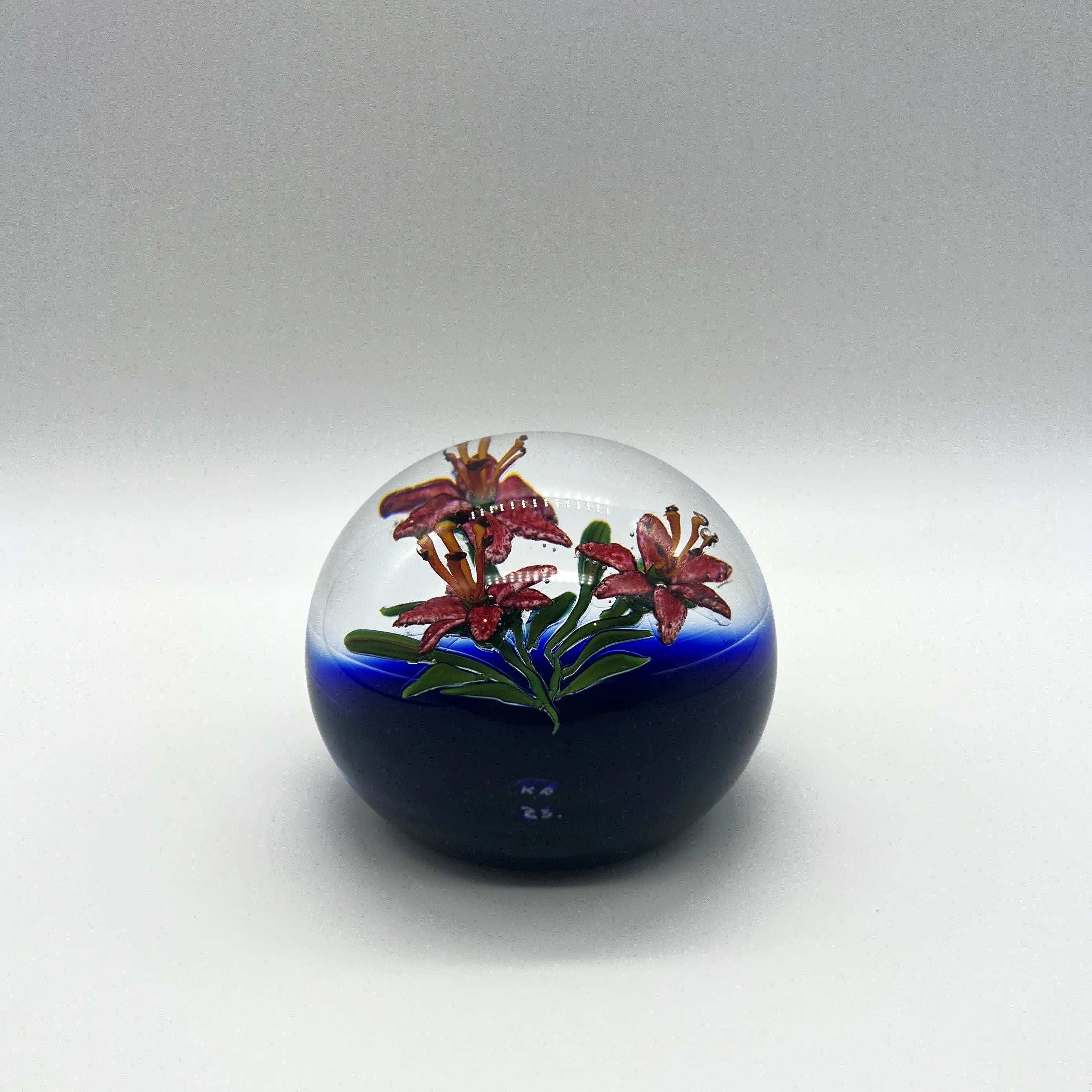 Lilies on Dark Background Paperweight by Ken Rosenfeld