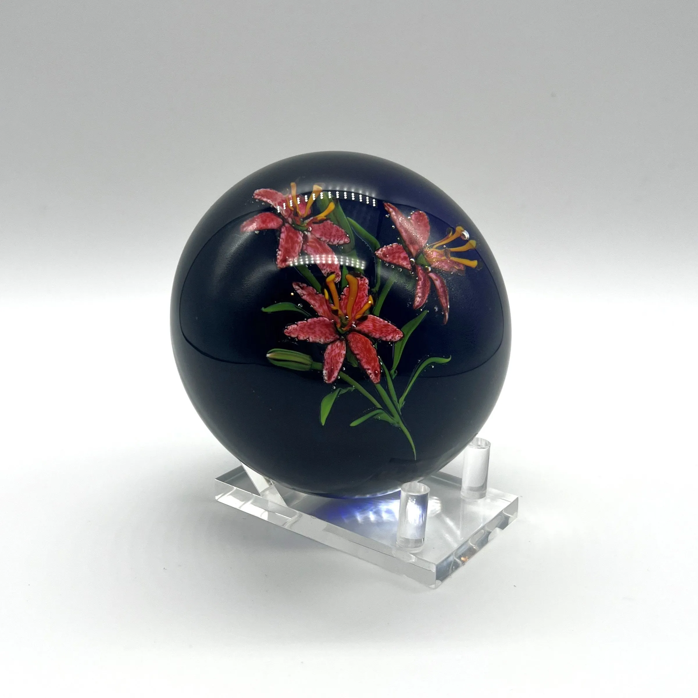 Lilies on Dark Background Paperweight by Ken Rosenfeld